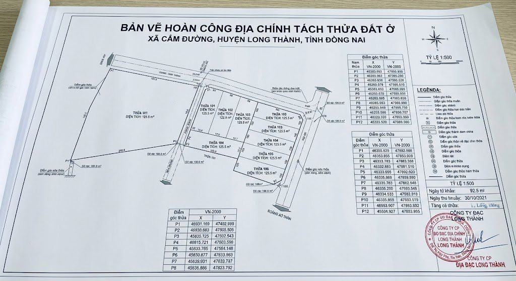 Bản vẽ hoàn công địa chính thể hiện tách thửa đất ở tại xã Cẩm Đường huyện Long Thành Đồng Nai, với đầy đủ tọa độ điểm góc thửa hệ VN-2000, diện tích từng thửa mới, đóng dấu đơn vị đo đạc có tư cách pháp nhân